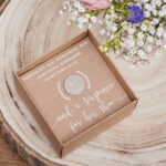 A silver sixpence in her shoe